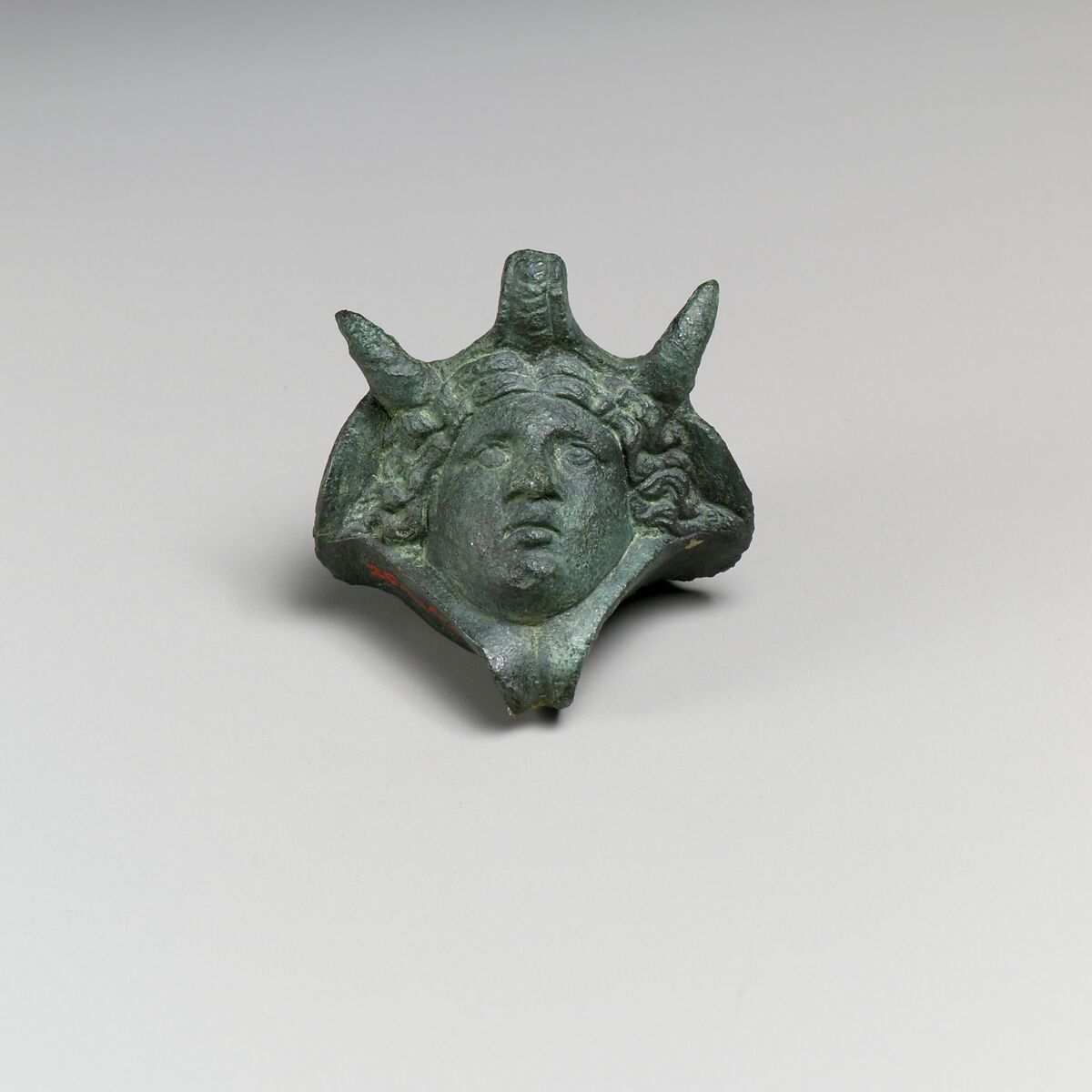 Decorative attachment in the form of a head wearing an elephant headdress, Bronze 