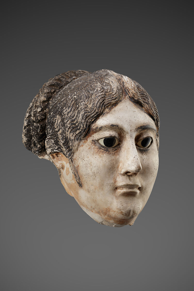 Mask of a woman with a large coil of plaited hair, Plaster, paint, glass