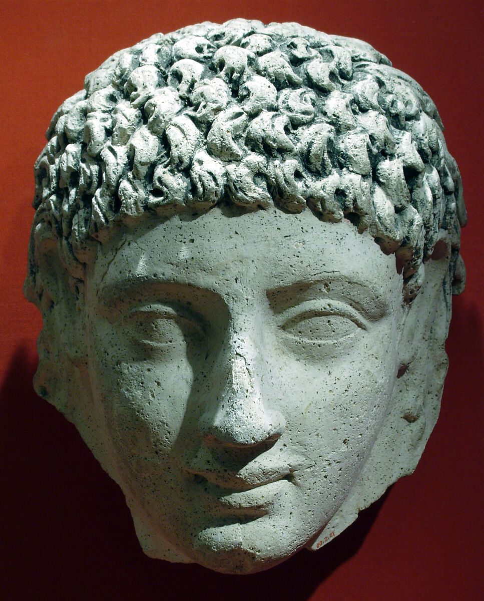 Mask of a young person with an unusual hairstyle, Plaster, paint 