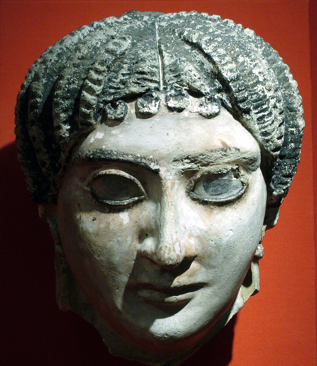 Mask of a woman with radiating waves of hair, Plaster, paint, glass 