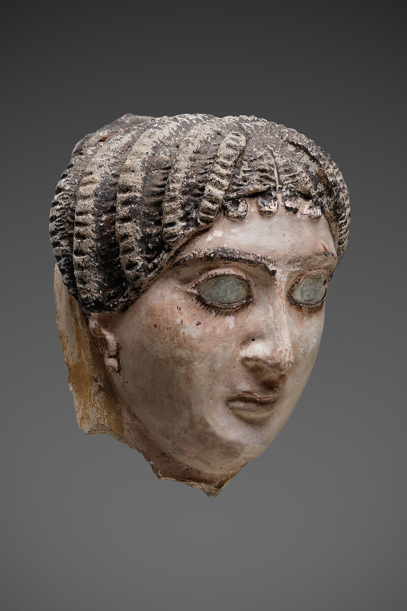 Mask of a woman with radiating waves of hair, Plaster, paint, glass