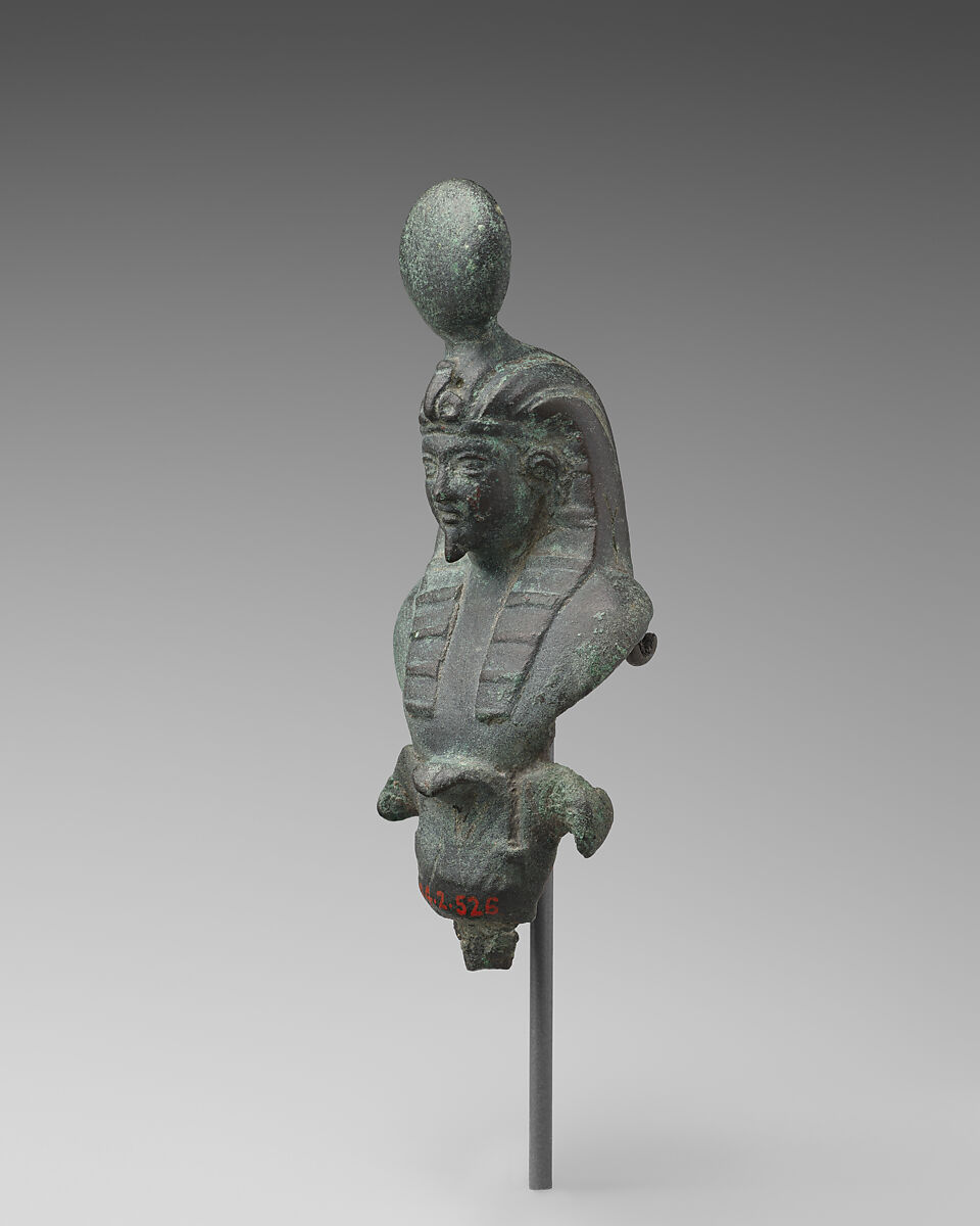 Finial with nemes and crowned figure, probably Osiris, Bronze