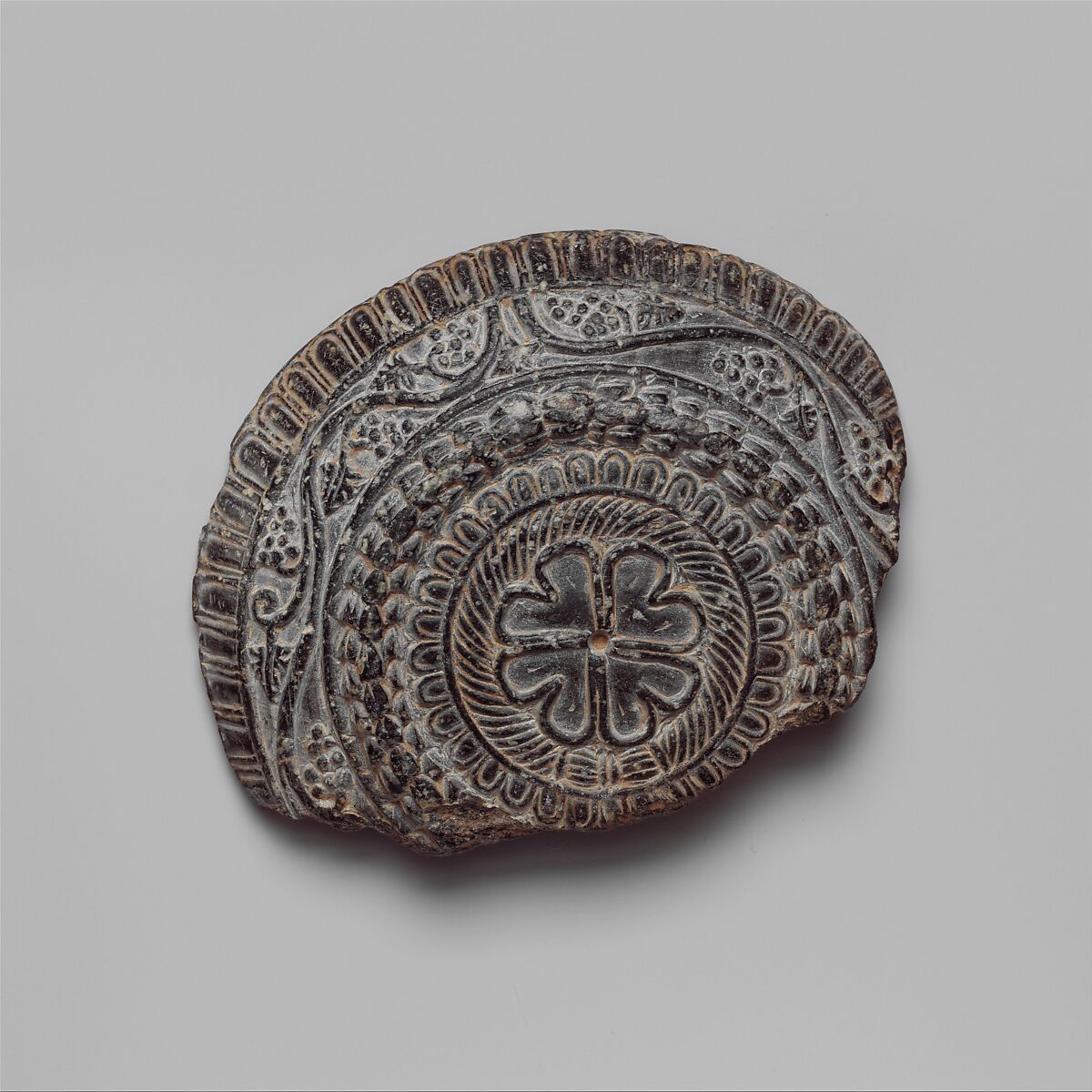 Shallow dish with high relief figures of Isis and falcon-headed Horus, Steatite