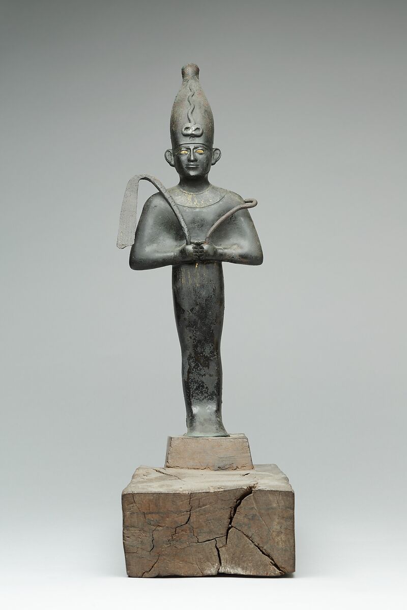 Osiris offered by the Astronomer of the House of Amun, Ibeb, Leaded bronze; precious-metal leaf; inlays of other materials; wood base with ink or black paint inscription