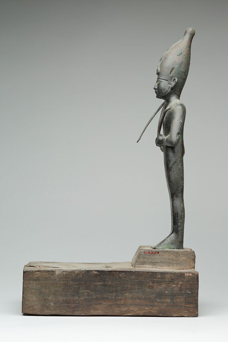 Osiris offered by the Astronomer of the House of Amun, Ibeb, Leaded bronze; precious-metal leaf; inlays of other materials; wood base with ink or black paint inscription