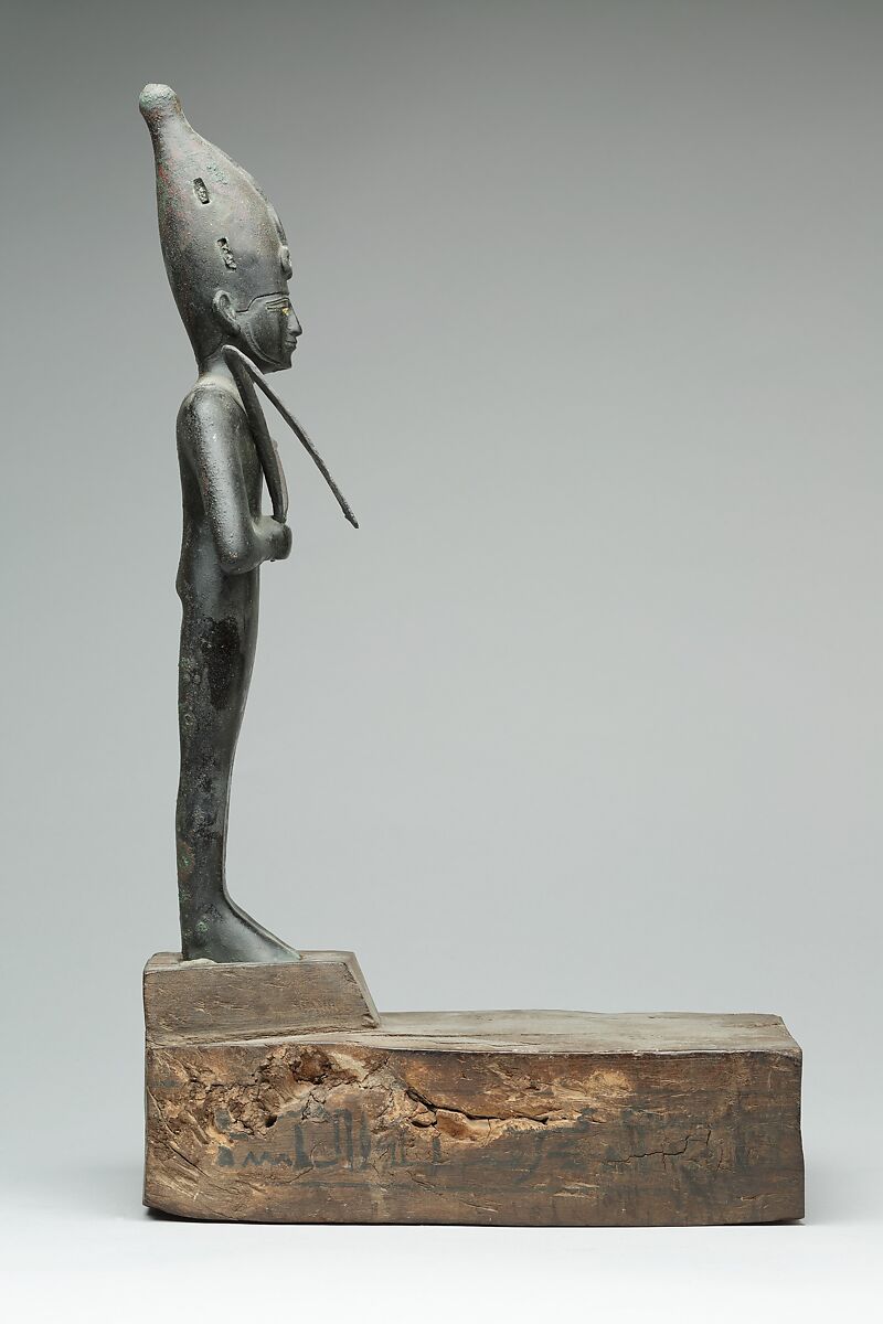 Osiris offered by the Astronomer of the House of Amun, Ibeb, Leaded bronze; precious-metal leaf; inlays of other materials; wood base with ink or black paint inscription