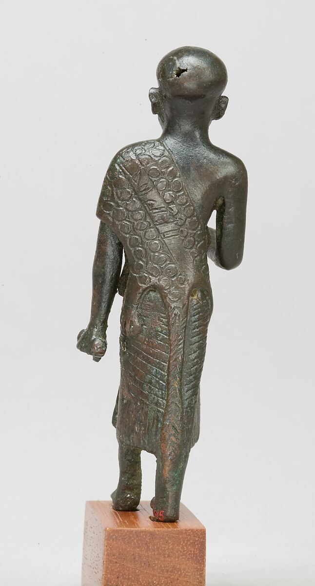 Priest in a leopard skin cloak with an inscription and Osiris on his skirt, Leaded bronze