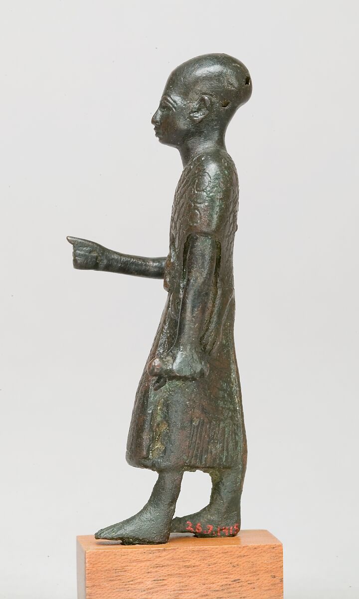 Priest in a leopard skin cloak with an inscription and Osiris on his skirt, Leaded bronze