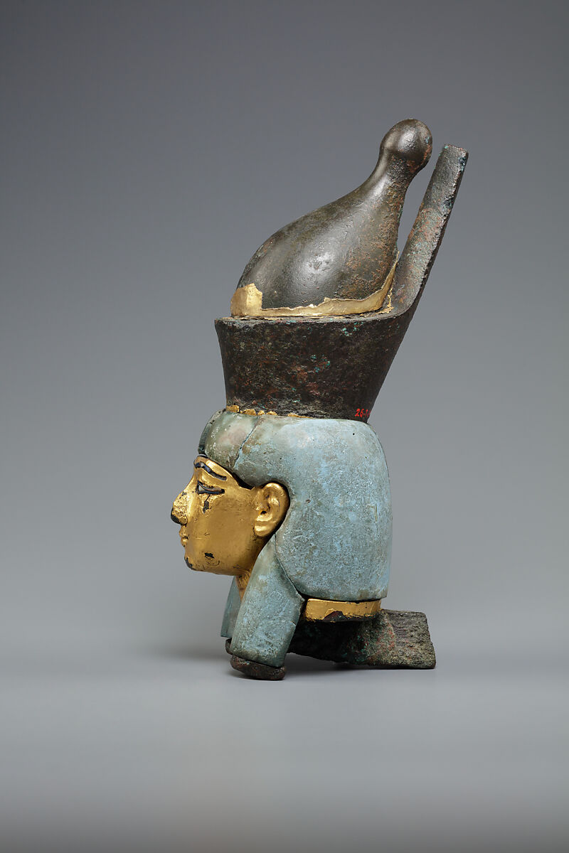 Attachment in the form of the head of a goddess wearing the double crown, Leaded bronze, gold and electrum sheet on crown, Egyptian blue and glass inlays