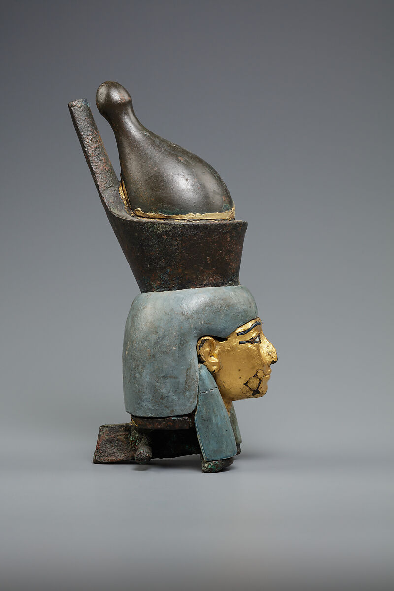 Attachment in the form of the head of a goddess wearing the double crown, Leaded bronze, gold and electrum sheet on crown, Egyptian blue and glass inlays