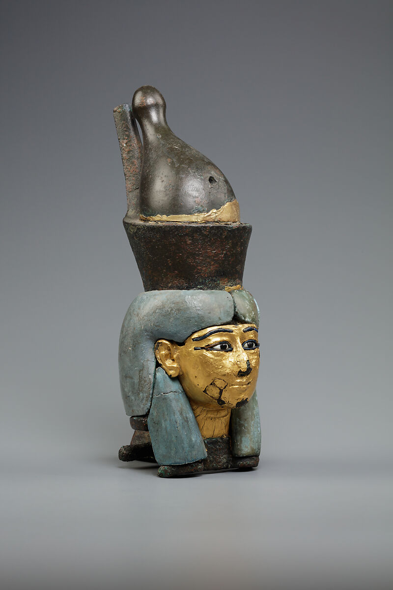 Attachment in the form of the head of a goddess wearing the double crown, Leaded bronze, gold and electrum sheet on crown, Egyptian blue and glass inlays