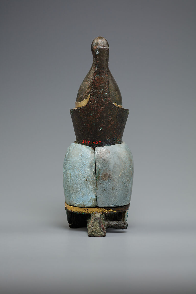 Attachment in the form of the head of a goddess wearing the double crown, Leaded bronze, gold and electrum sheet on crown, Egyptian blue and glass inlays