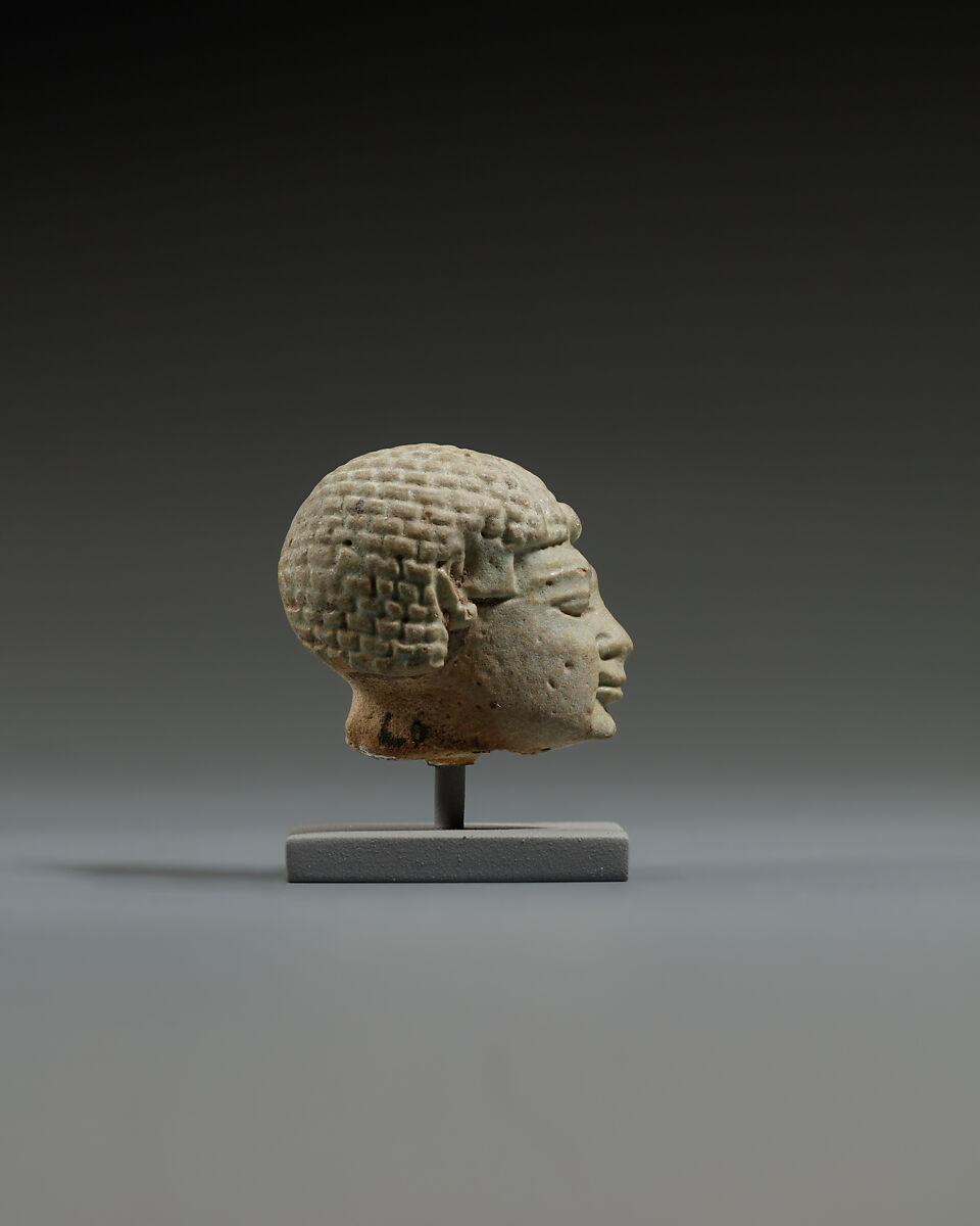 Head from a statuette, perhaps of  a dwarf, Faience
