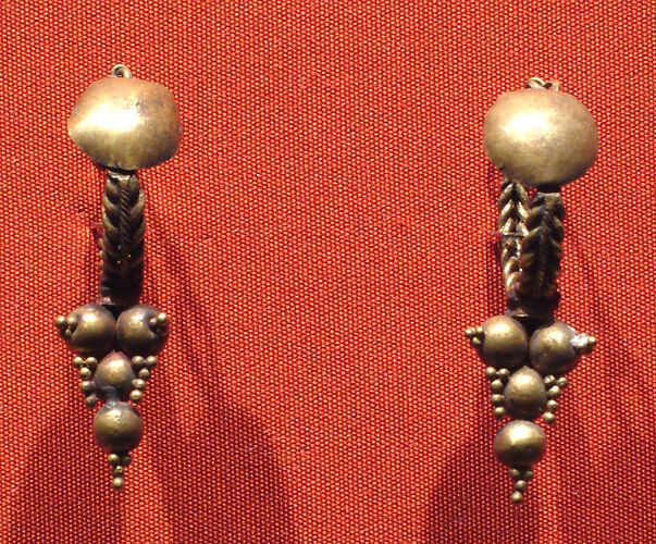 Hoop earrings with disk and with conical pendant of balls and granules