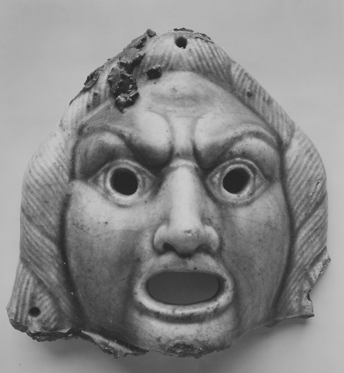Theatrical mask for offering, faience