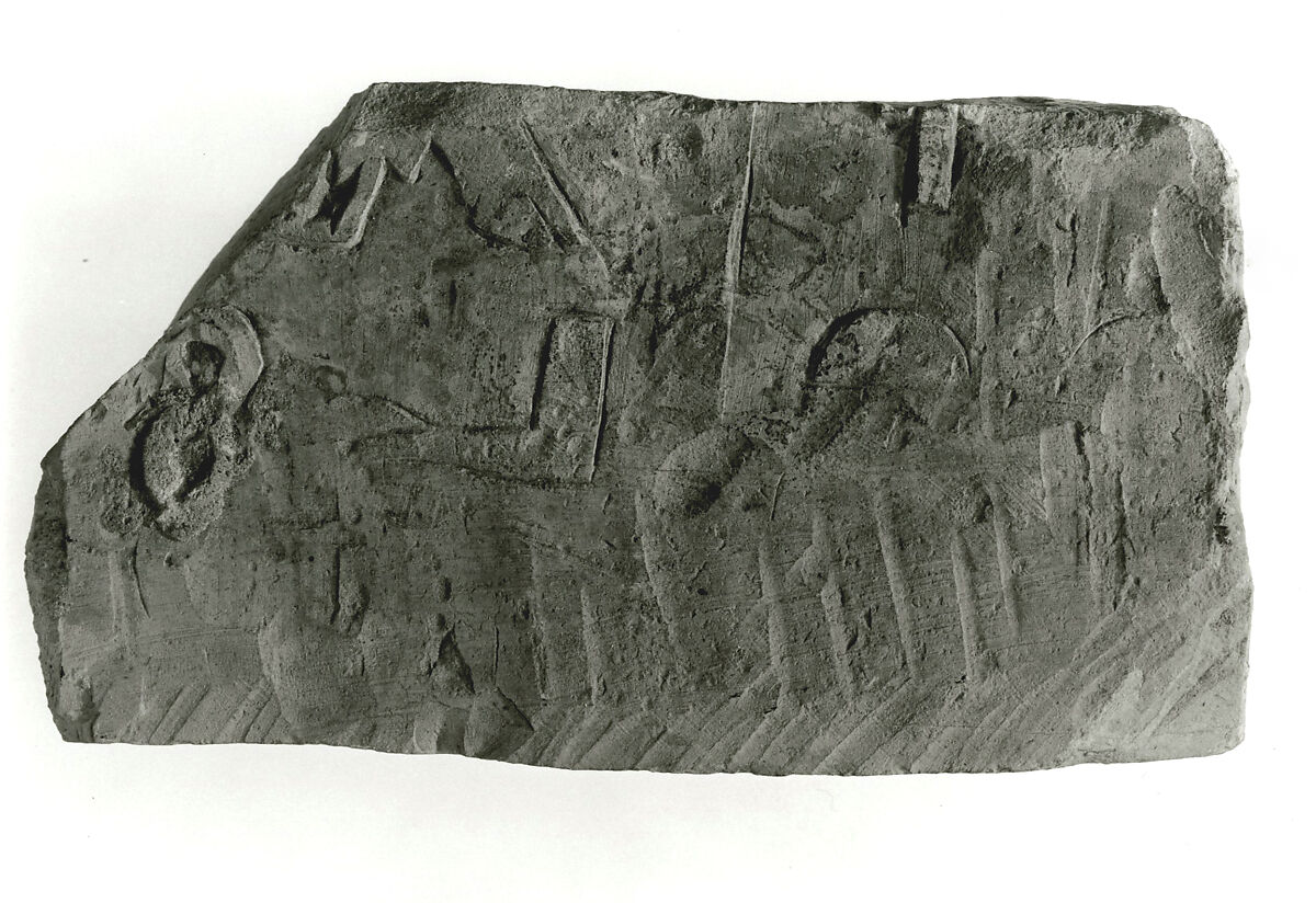 Raised relief fragment, Limestone, traces of mortar 