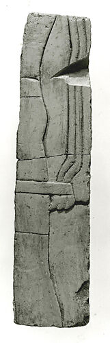 Raised relief fragment of three men with a rope