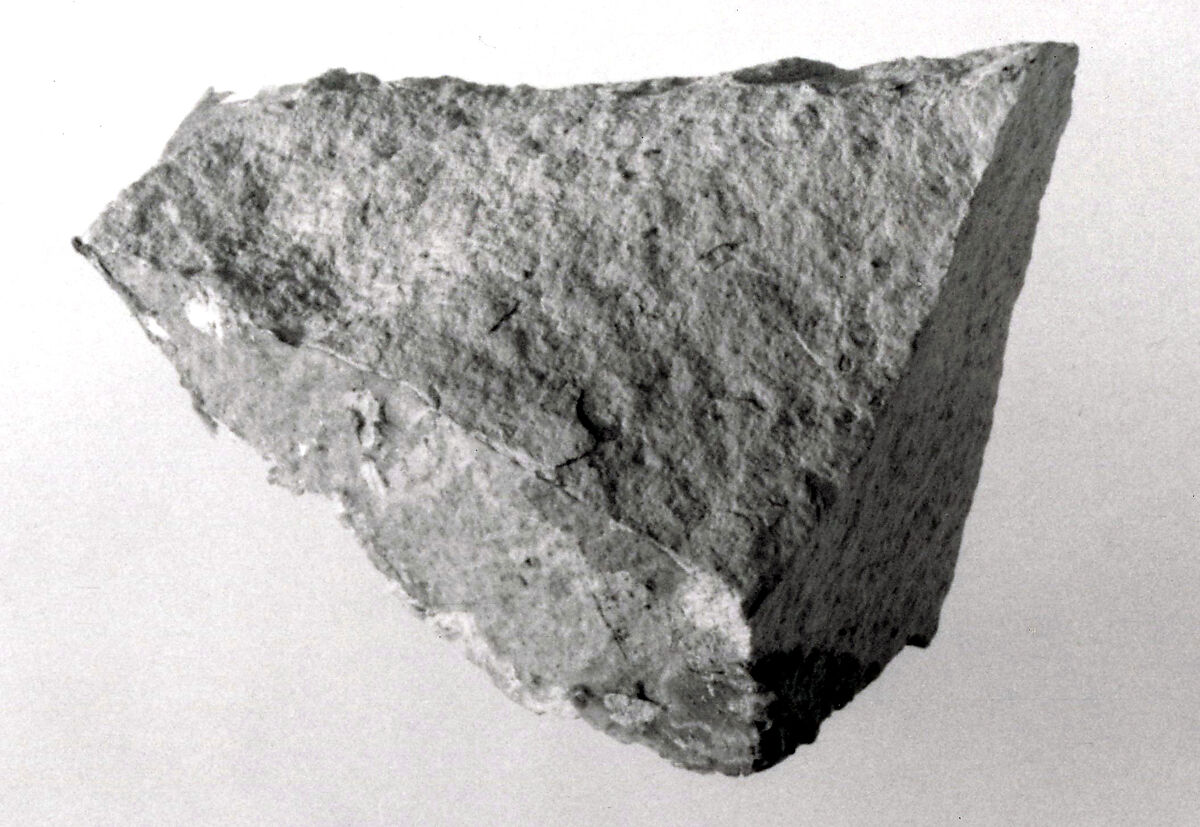 Raised relief fragment, Limestone, stains