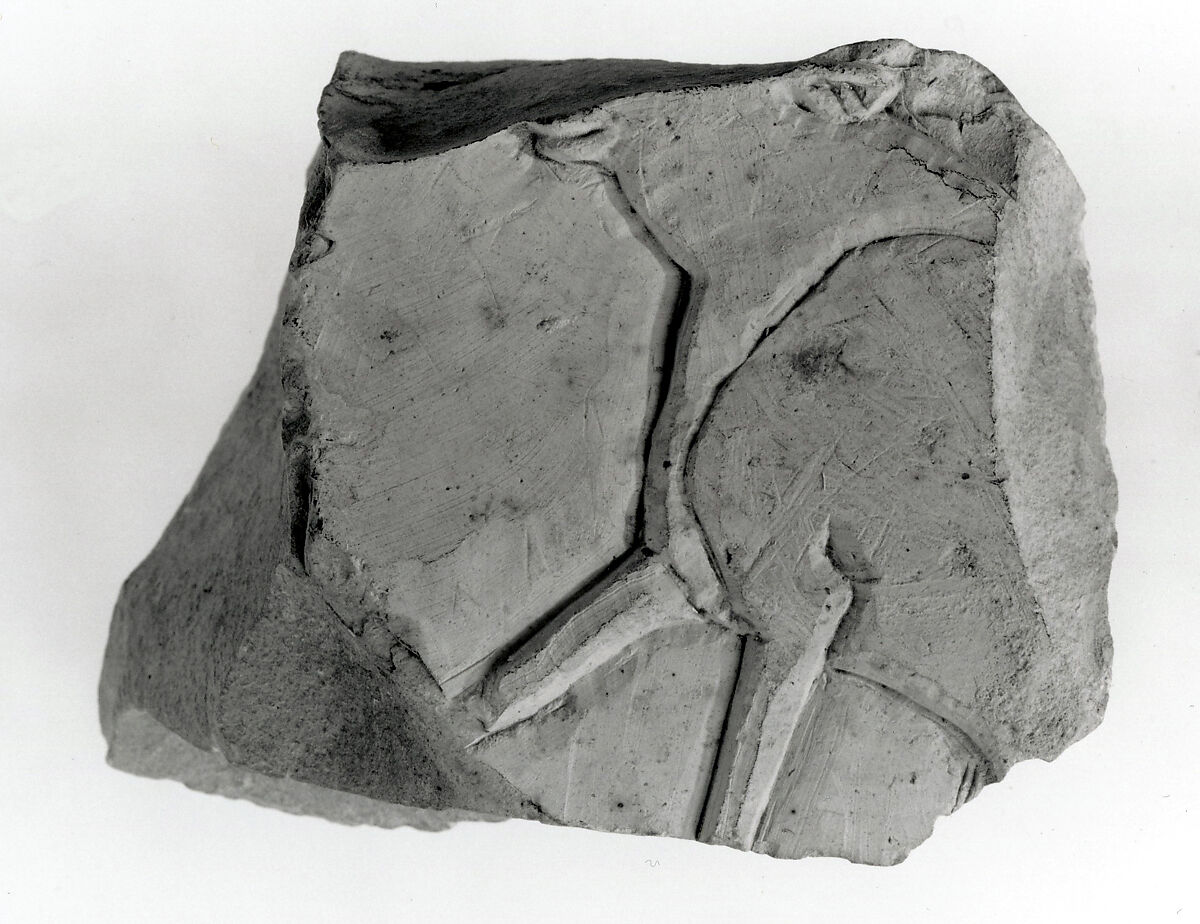 Raised relief fragment, Limestone, stains 