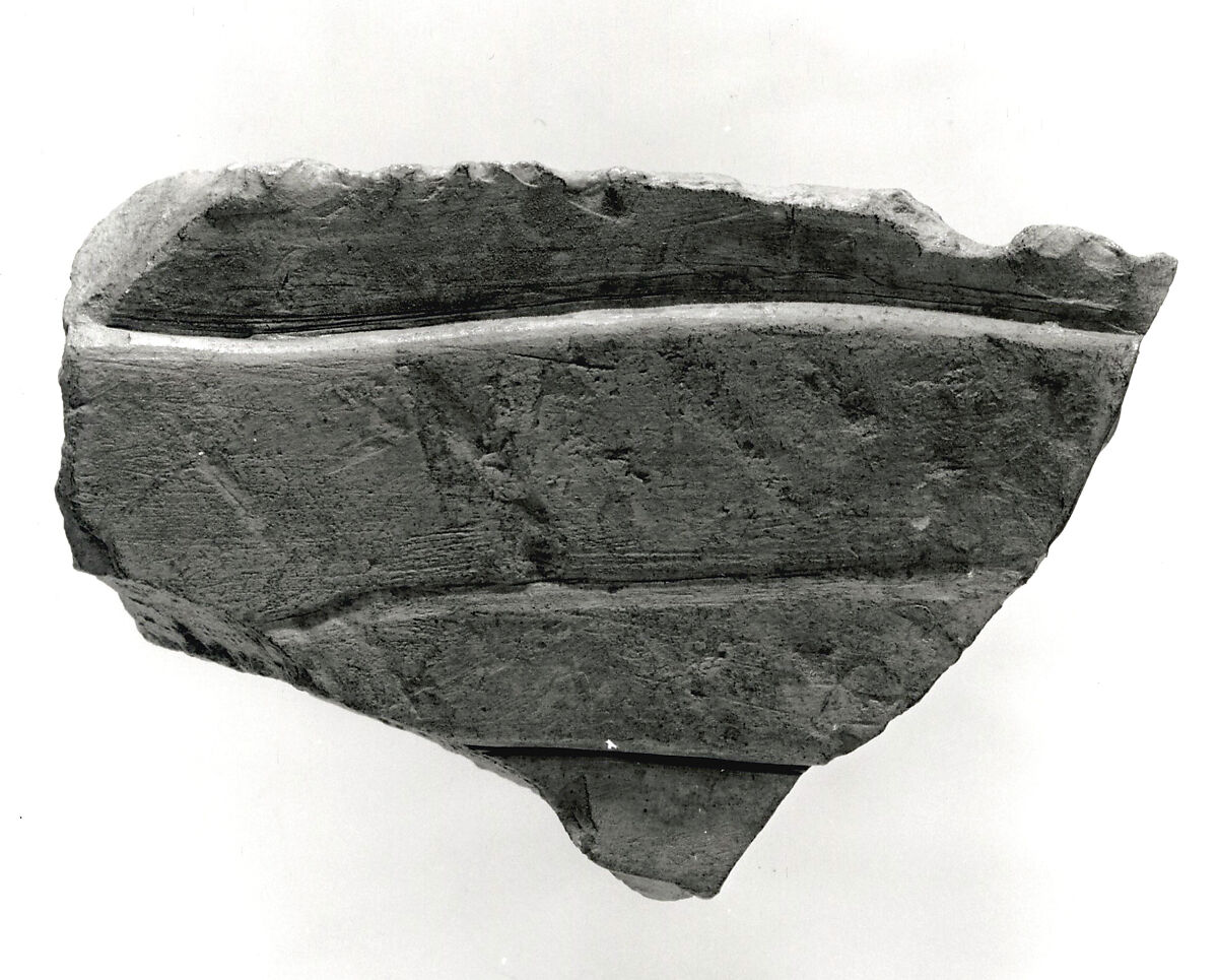 Raised relief fragment, Limestone, stains