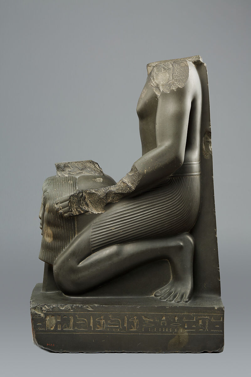 Kneeling statue of Amenemopetemhat holding the Hathor emblem, Metagraywacke