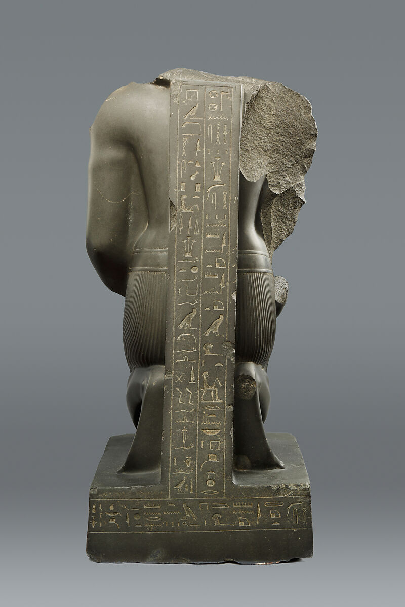 Kneeling statue of Amenemopetemhat holding the Hathor emblem, Metagraywacke