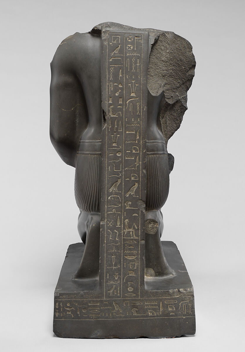 Kneeling statue of Amenemopetemhat holding the Hathor emblem, Metagraywacke