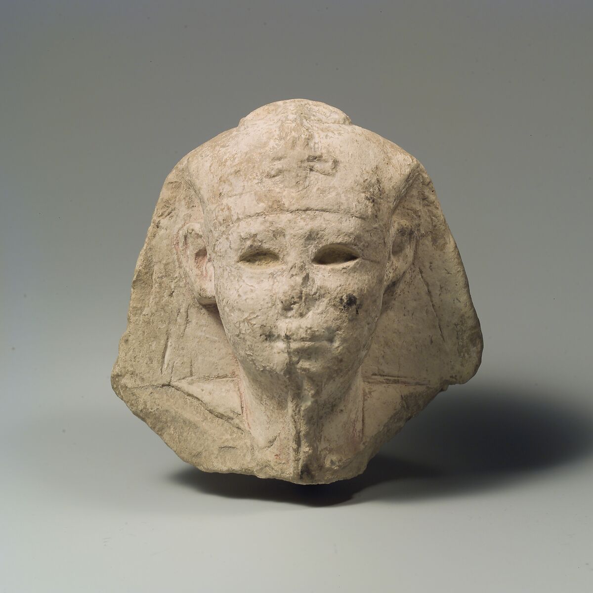 Head of a king as Khepri, possibly Ptolemy VI Philometor, Limestone, paint traces 