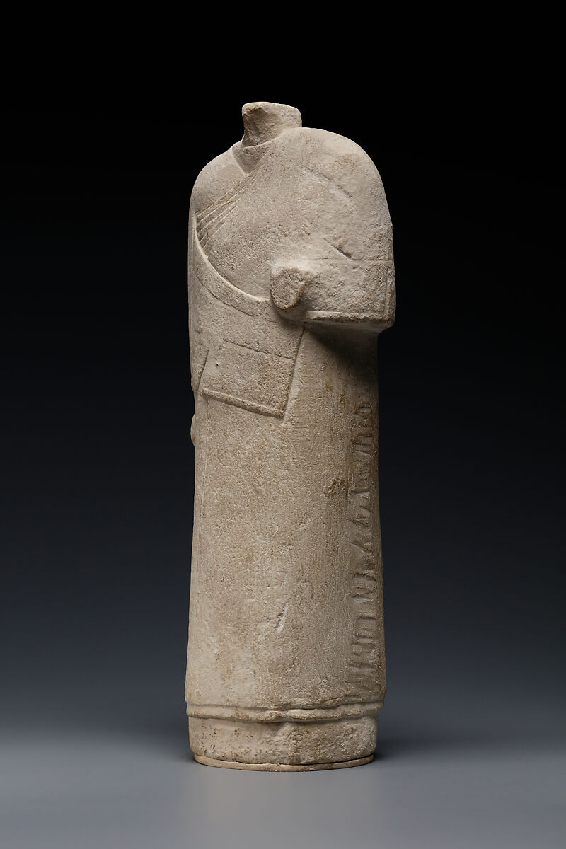 Incomplete figure in draped costume, Limestone