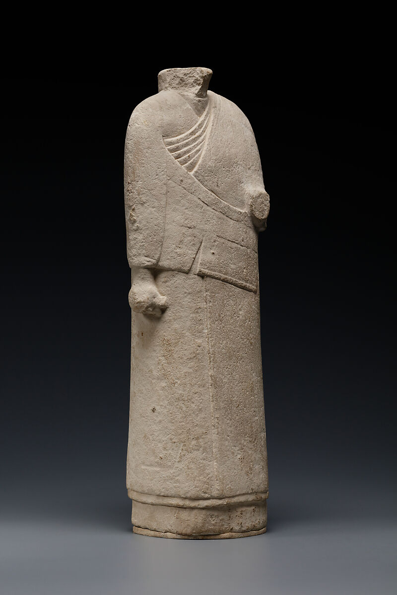 Incomplete figure in draped costume, Limestone