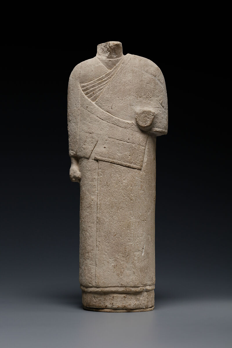 Incomplete figure in draped costume, Limestone 