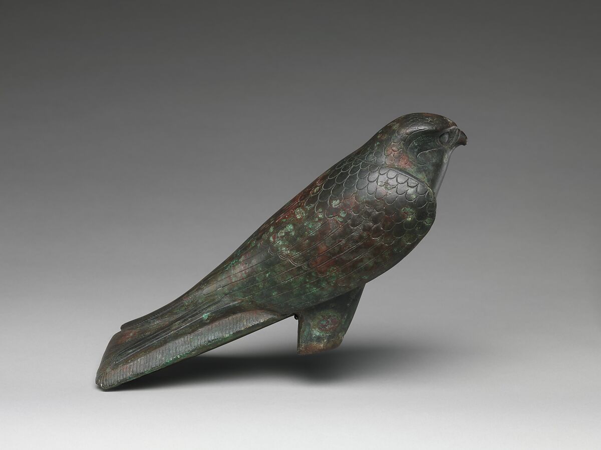 Falcon statue serving as a sarcophagus for a sacred animal, Cupreous metal, animal remains 