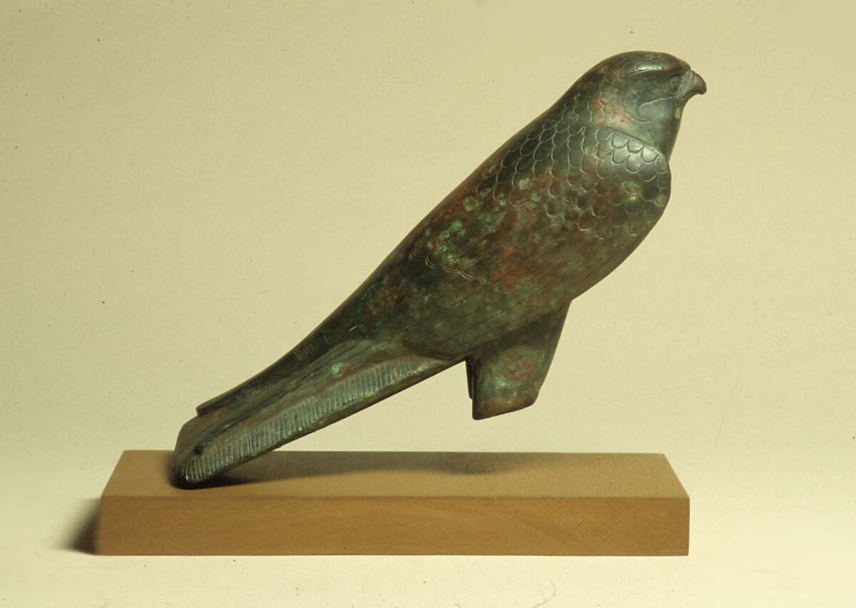 Falcon statue serving as a sarcophagus for a sacred animal, Cupreous metal, animal remains