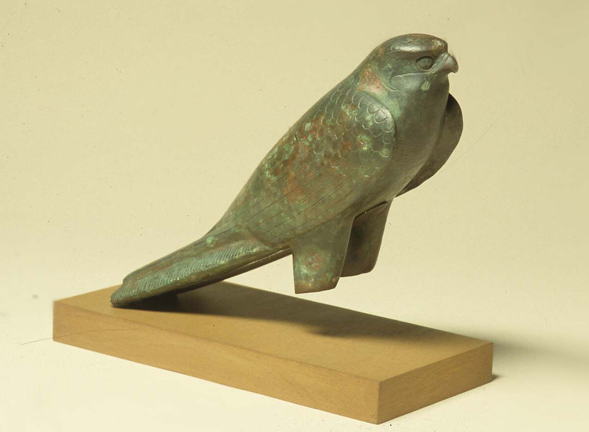 Falcon statue serving as a sarcophagus for a sacred animal, Cupreous metal, animal remains
