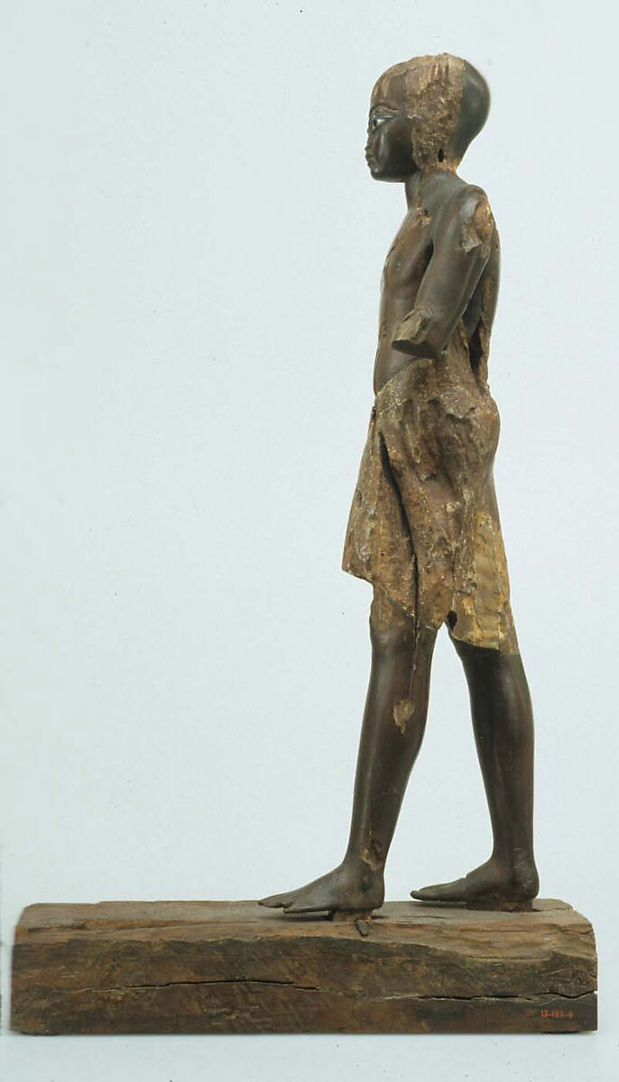 Statuette of a Young Man, Wood (probably ebony), gesso, linen, glass inlay
