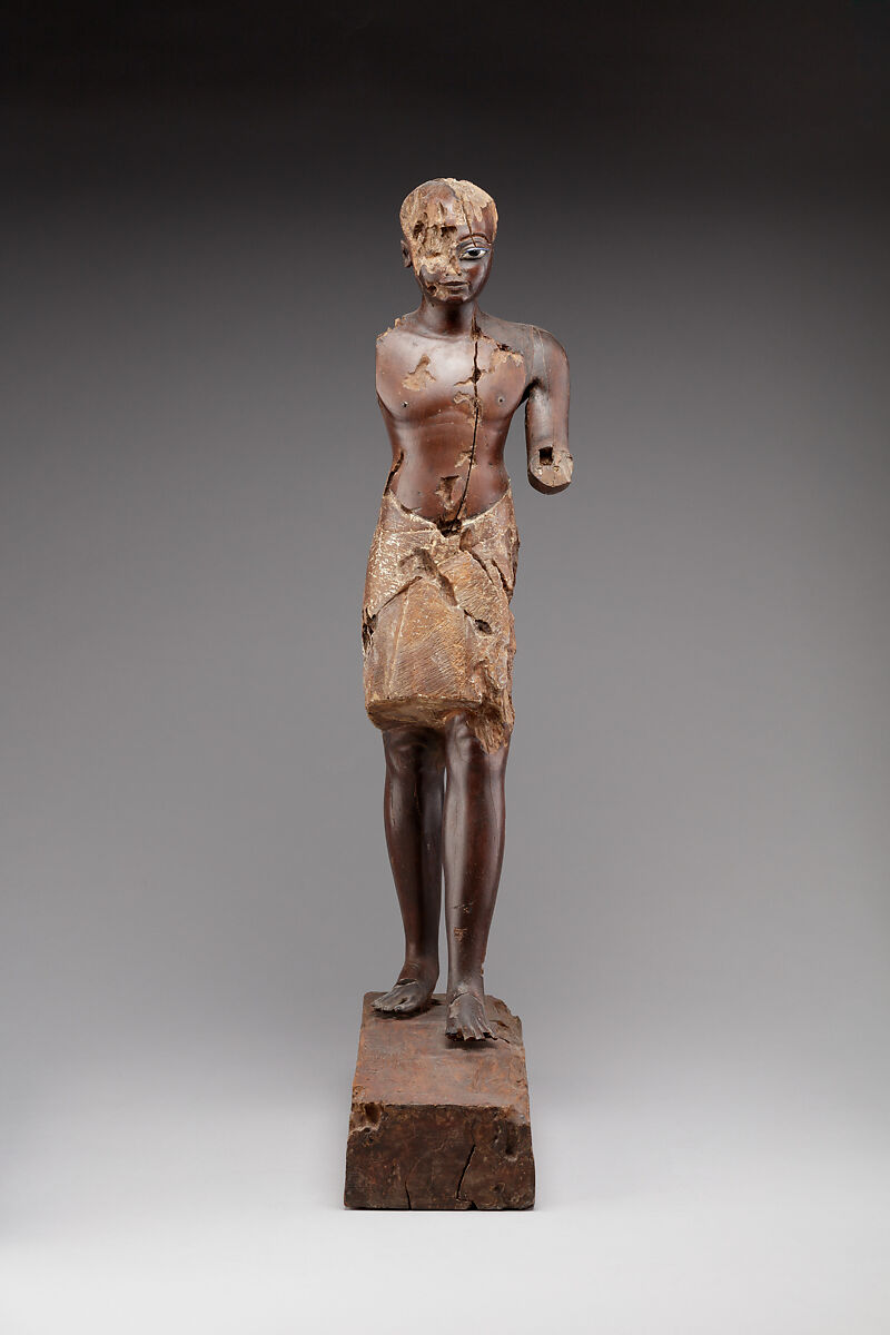 Statuette of a Young Man, Wood (probably ebony), gesso, linen, glass inlay 
