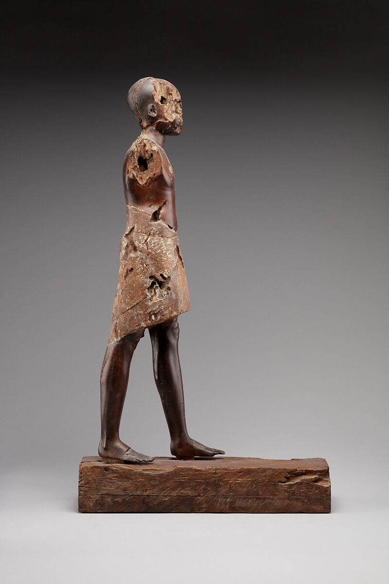 Statuette of a Young Man, Wood (probably ebony), gesso, linen, glass inlay
