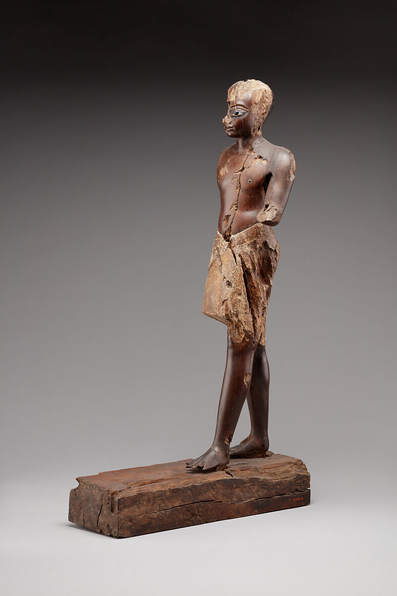 Statuette of a Young Man, Wood (probably ebony), gesso, linen, glass inlay
