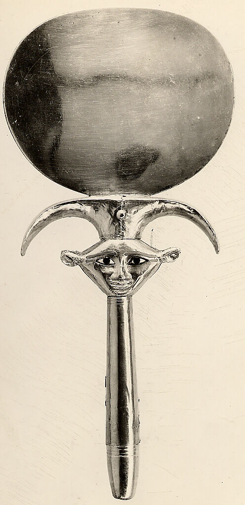 Mirror with a papyrus-shaped handle displaying a Bat-like face, Silver disk with a wood (modern) handle sheathed in gold; the inlays are modern