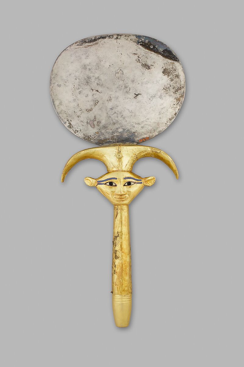Mirror with a papyrus-shaped handle displaying a Bat-like face, Silver disk with a wood (modern) handle sheathed in gold; the inlays are modern