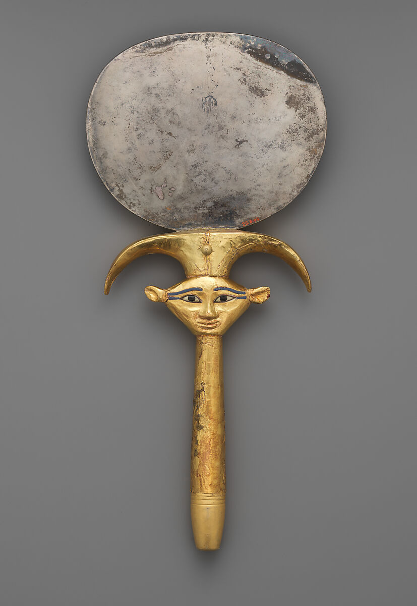 Mirror with a papyrus-shaped handle displaying a Bat-like face, Silver disk with a wood (modern) handle sheathed in gold; the inlays are modern