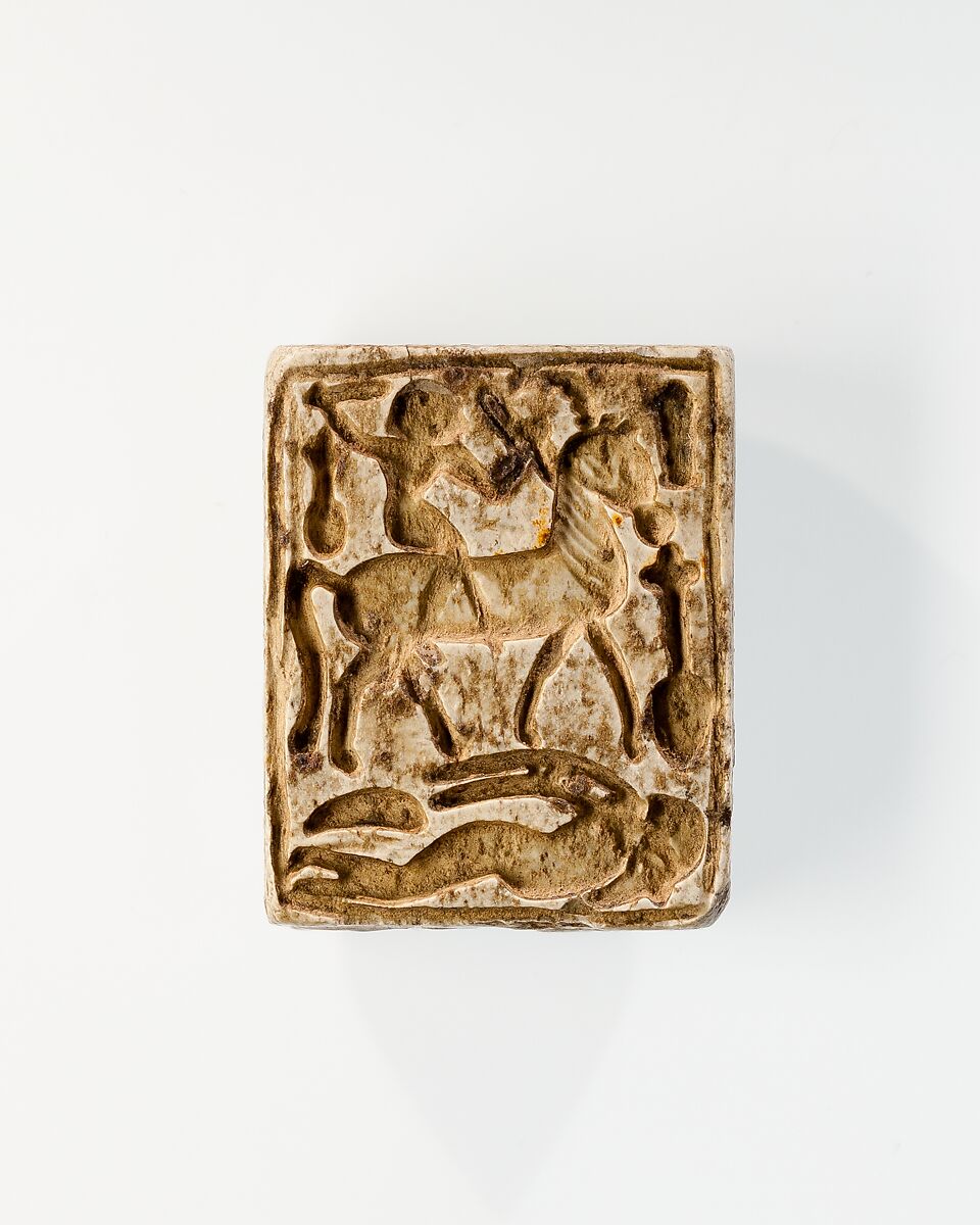 Plaque: side 1, Sakhmet and Nefertum on either side of the name Menkheperre (Thutmose III); side 2, rider and trampled captive, Steatite