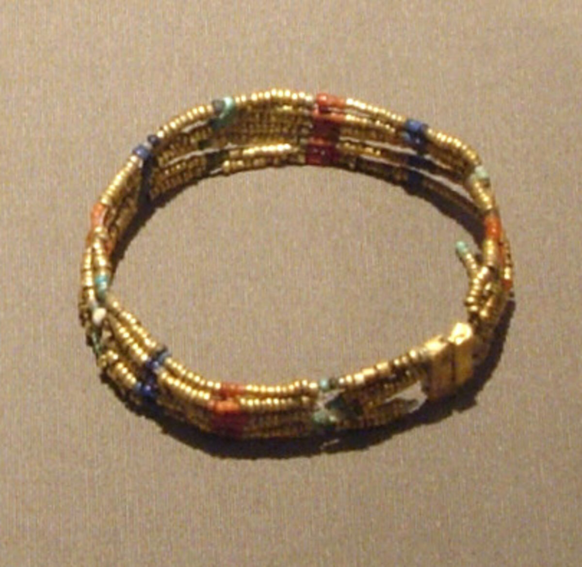 Beaded Armlet, Gold, carnelian, lapis lazuli, blue and green glass, faience on bronze or copper wire 
