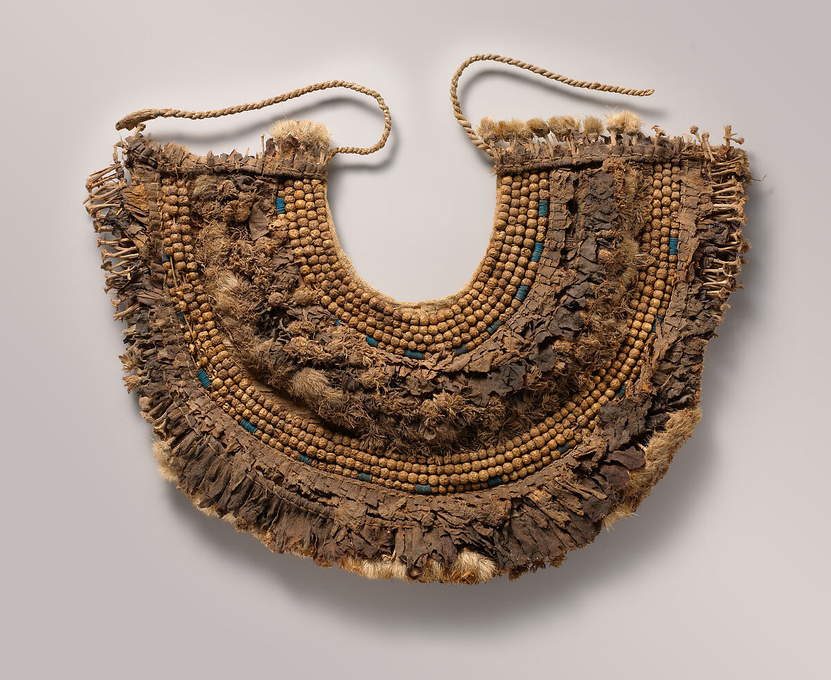 Floral Collar from Tutankhamun's Embalming Cache, Papyrus, olive leaves, persea leaves, cornflowers, blue lotus petals, Picris flowers, nightshade berries, faience, linen 