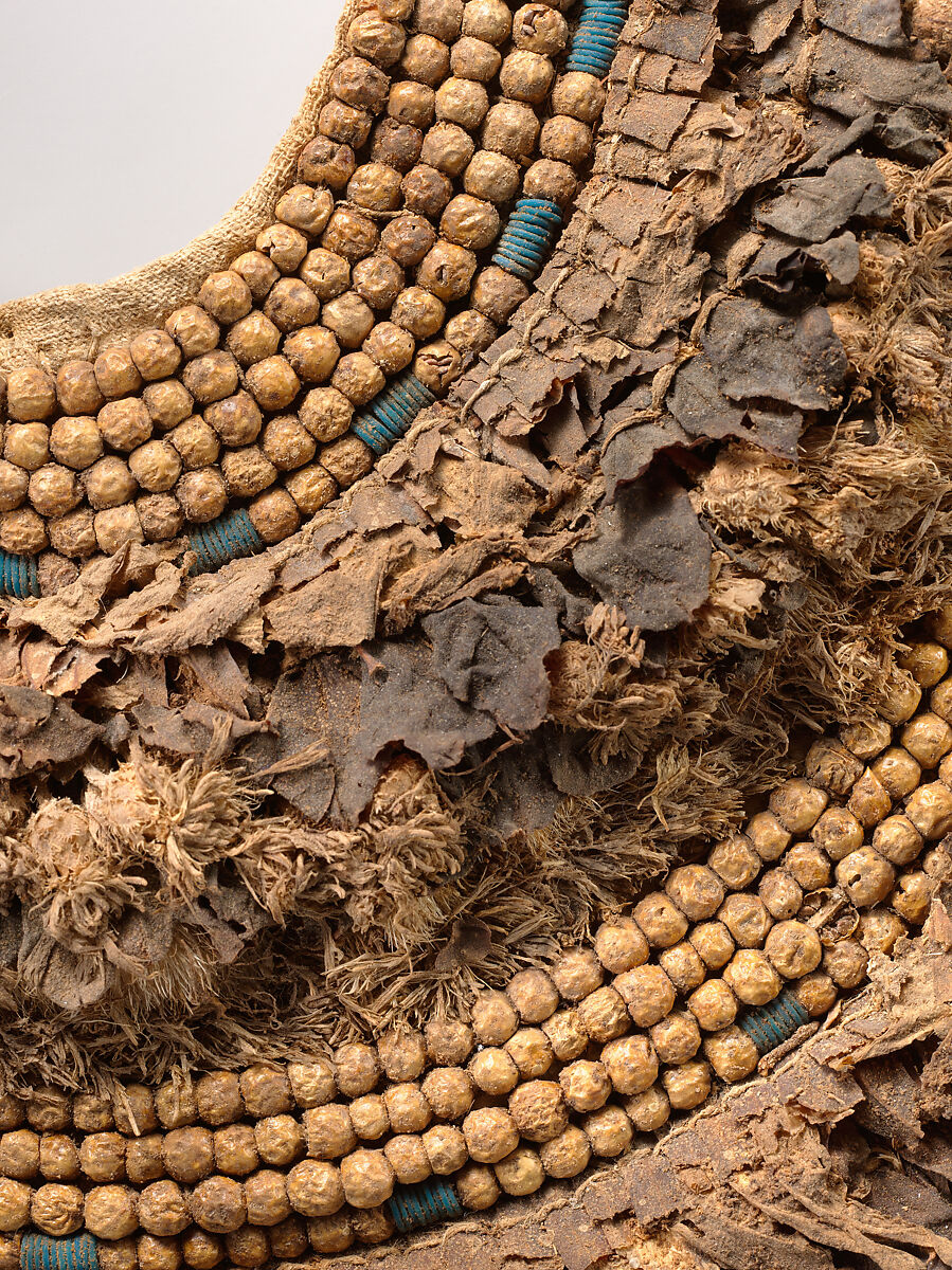 Floral Collar from Tutankhamun's Embalming Cache, Papyrus, olive leaves, persea leaves, cornflowers, blue lotus petals, Picris flowers, nightshade berries, faience, linen