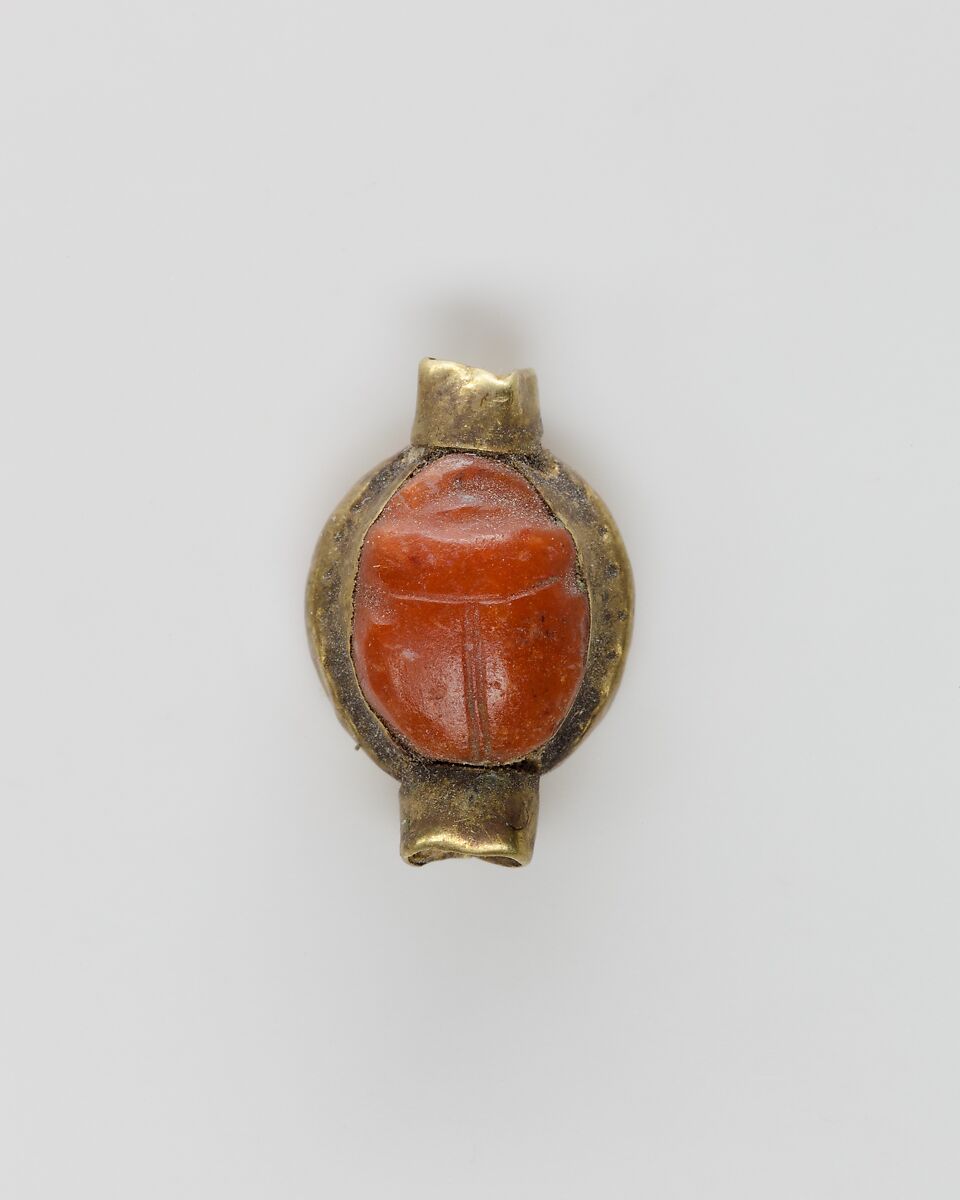 Scarab set in a ring bezel, carnelian, gold 