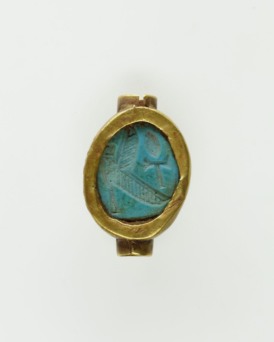 Cowroid Set in a Ring Bezel, Gold, glassy faience 