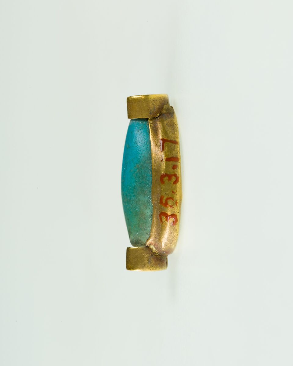 Cowroid Set in a Ring Bezel, Gold, glassy faience
