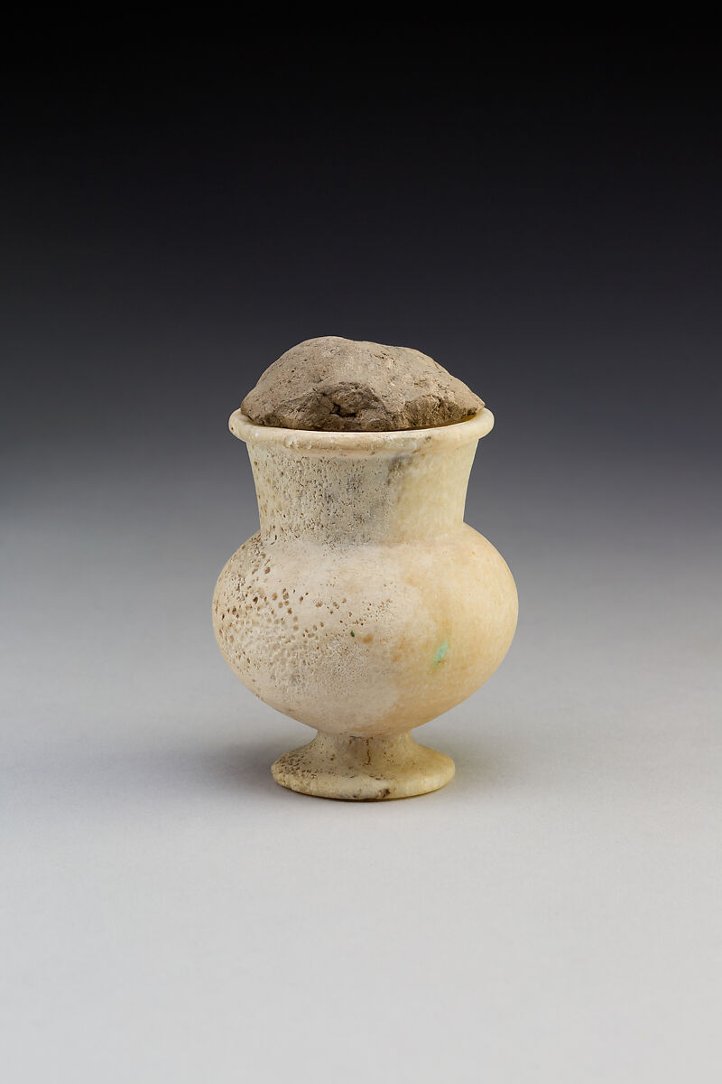 Open-Mouthed Cosmetic Jar with Mud Stopper, Travertine (Egyptian alabaster), mud 