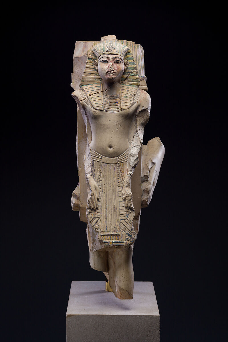 Figure of a king as part of a group proffered by an official of Ramesses II, Limestone, paint 